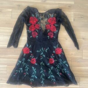 Elegant Black Dress with Red Floral Design